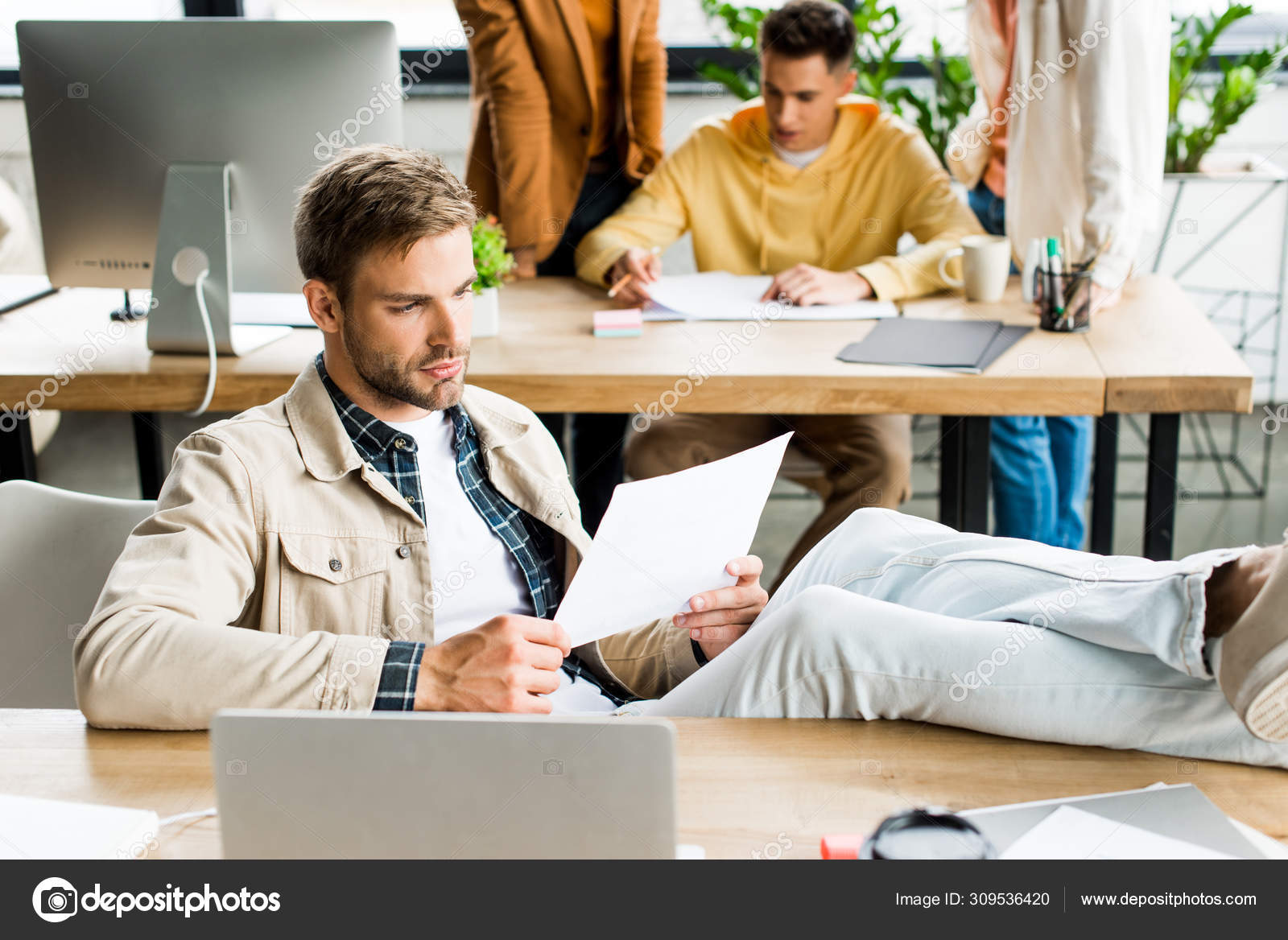 Young Businessman Sitting Legs Desk Colleagues Working Office