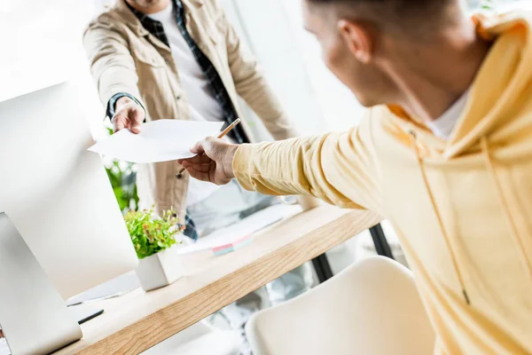 Cropped View Young Businessman Giving Paper Colleague Office — Stock Photo, Image