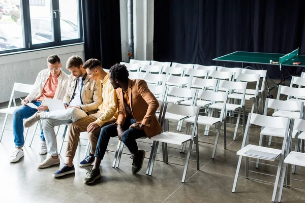 Four Young Multicultural Businessmen Discussing Startup Project While Sitting Conference — Stock Photo, Image