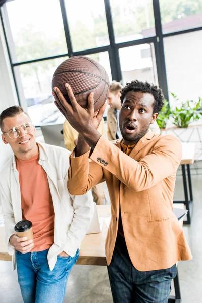 African American Businessman Playing Volleyball While Standing Colleague Holding Coffee — 스톡 사진
