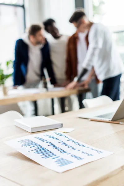 Selective Focus Paper Graphs Charts Desk Businesspeople Standing Workplace Office — Stock Photo, Image