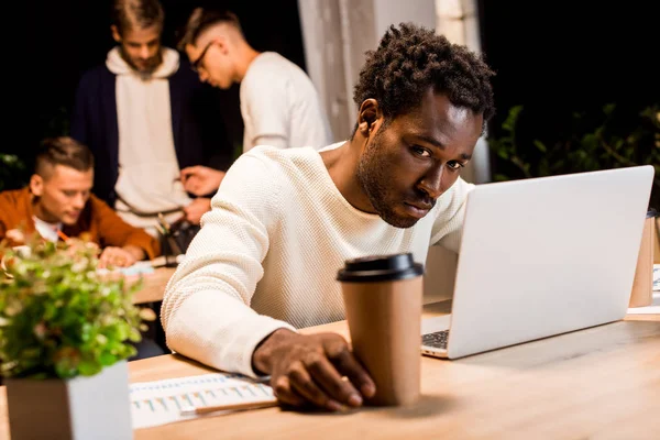 Selective Focus Exhausted African American Businessman Holding Coffee While Working — Stock Photo, Image