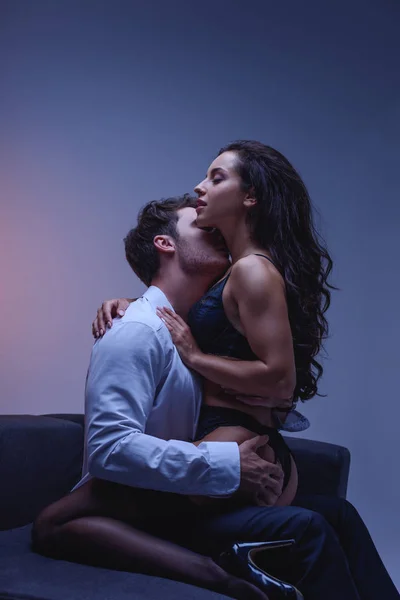 Young Man White Shirt Embracing Kissing Seductive Girlfriend Black Lingerie — Stock Photo, Image