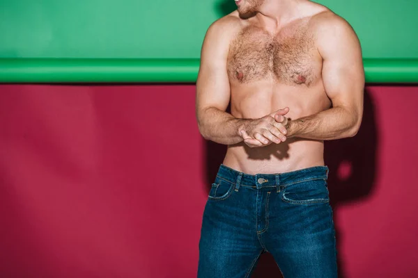 Cropped View Shirtless Man Denim Jeans Posing Green Red Background — Stock Photo, Image