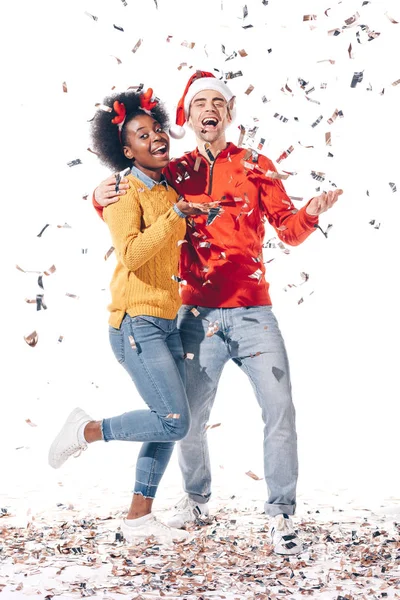 Beautiful Happy Multicultural Couple Santa Hat Deer Horns Celebrating Confetti — Stock Photo, Image