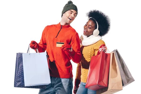 Beautiful Multiethnic Couple Winter Sweaters Holding Credit Card Shopping Bags — Stock Photo, Image