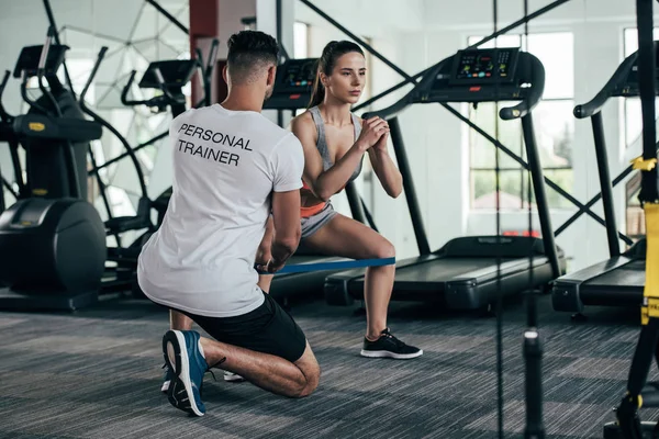 Back View Personal Trainer Controlling Attractive Sportswoman Exercising Resistance Band — Stock Photo, Image