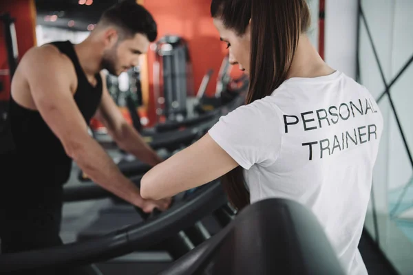Selective Focus Personal Trainer Standing Sportsman Running Treadmill — Stock Photo, Image