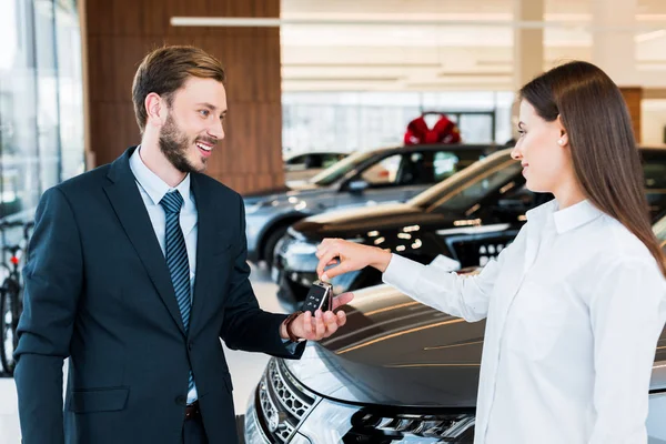Selective Focus Woman Giving Car Key Happy Bearded Man Suit — Stock Photo, Image