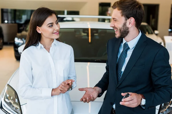 Happy Bearded Man Gesturing While Looking Attractive Woman — Stock Photo, Image