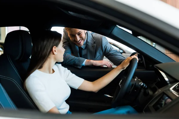 Selective Focus Smiling Woman Sitting Car Bearded Man Car Showroom — Stock Photo, Image