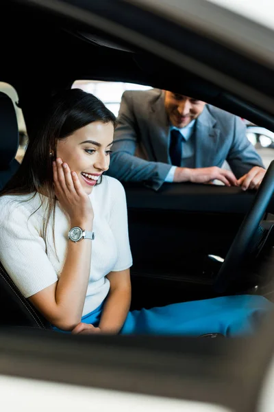 Selective Focus Excited Girl Sitting Car Bearded Man Car Showroom — Stock Photo, Image