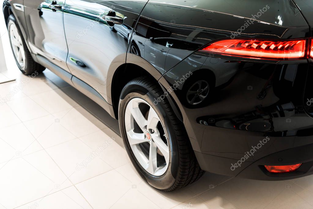black and luxury car in car showroom  