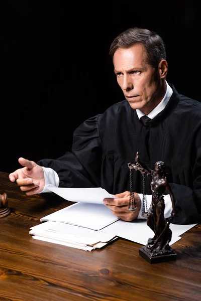 Judge Judicial Robe Sitting Table Holding Paper Isolated Black — Stock Photo, Image