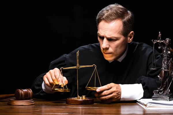 Judge Judicial Robe Sitting Table Holding Scales Justice Isolated Black — Stock Photo, Image