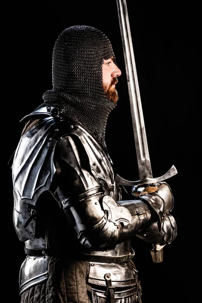 Side View Handsome Knight Armor Holding Sword Isolated Black — Stock Photo, Image