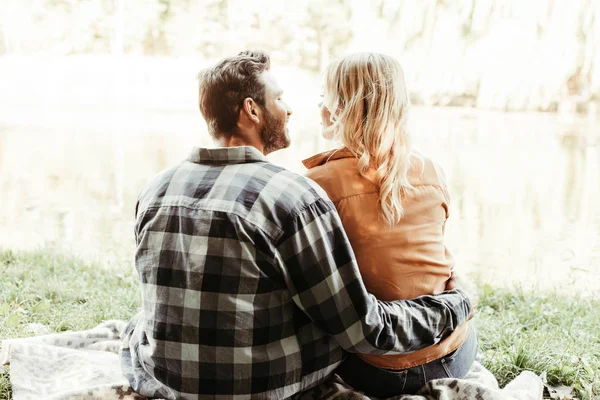 Back View Young Man Embracing Girlfriend While Sitting Lake Park — Stock Photo, Image