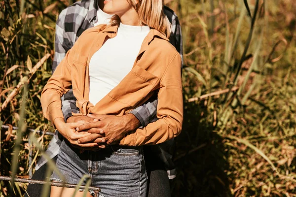 Cropped View Man Hugging Girlfriend Thicket Sedge Park — Stock Photo, Image