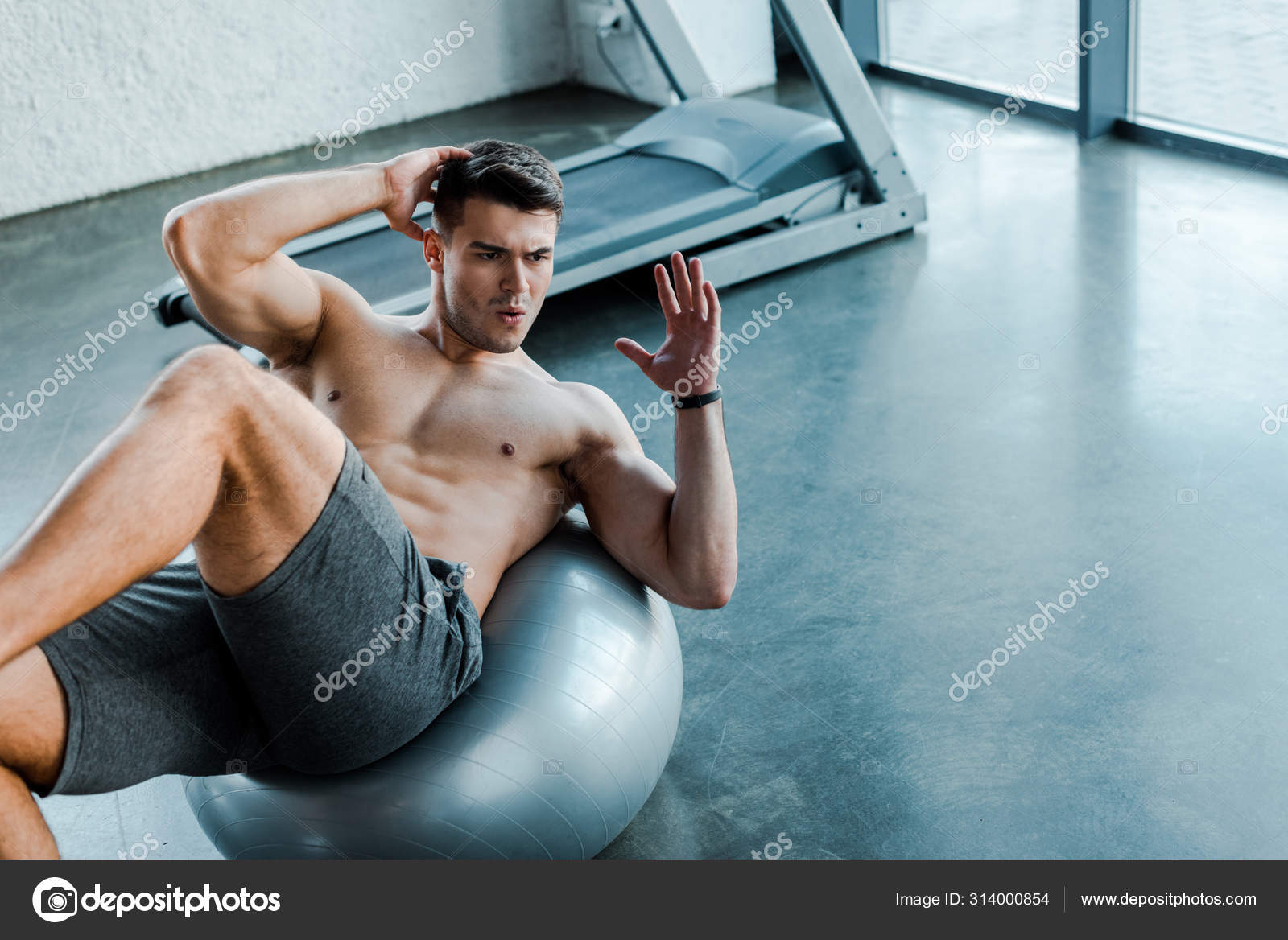 Handsome Sportsman Doing Crunches Fitness Ball Sports Center Stock