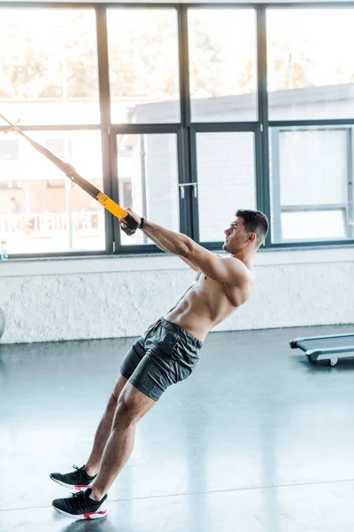 Side View Handsome Sportsman Working Out Suspension Trainer Sports Center — Stock Photo, Image