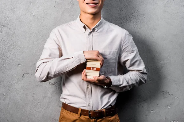 Cropped View Smiling Seo Manager Holding Wooden Rectangles Lettering Seo — Stock Photo, Image