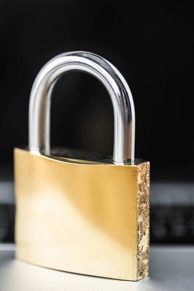 selective focus of metal padlock with copy space in office 