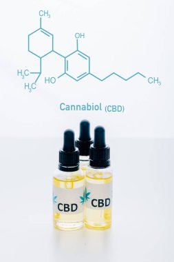 cbd oil in bottles isolated on white with cbd molecule illustration clipart