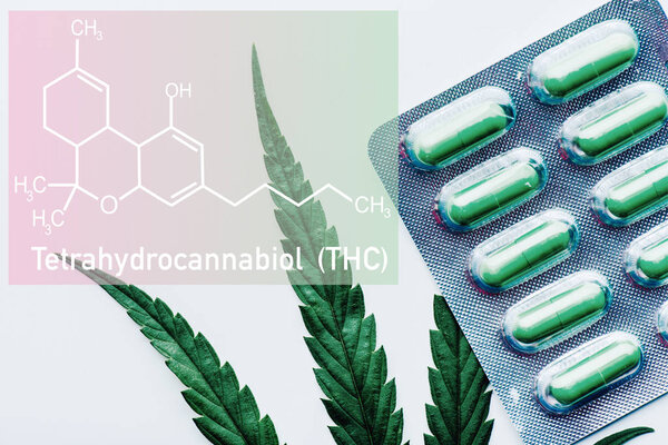 top view of green pills in blister and marijuana leaf on white background with THC  molecule illustration
