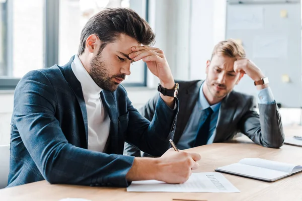 Selective Focus Handsome Bearded Businessman Holding Pen Document Coworker Office — Stock Photo, Image