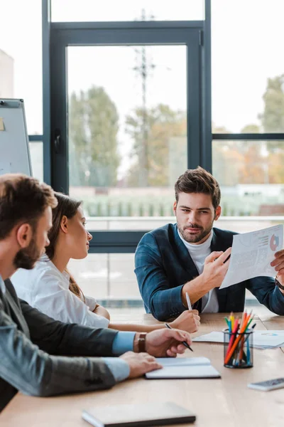 Selective Focus Businessman Holding Charts Graphs While Sitting Coworkers Office — ストック写真