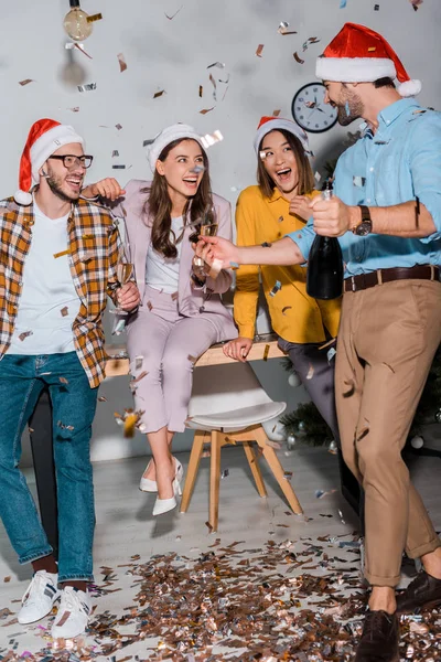 Happy Businessmen Multicultural Businesswomen Santa Hats Champagne Glasses Falling Confetti — Stock Photo, Image