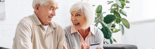 Panoramic Shot Smiling Husband Wife Holding Credit Card Apartment — Stock Photo, Image