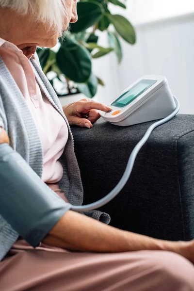 Cropped View Senior Woman Sitting Sofa Measuring Blood Pressure Apartment — Stock Photo, Image