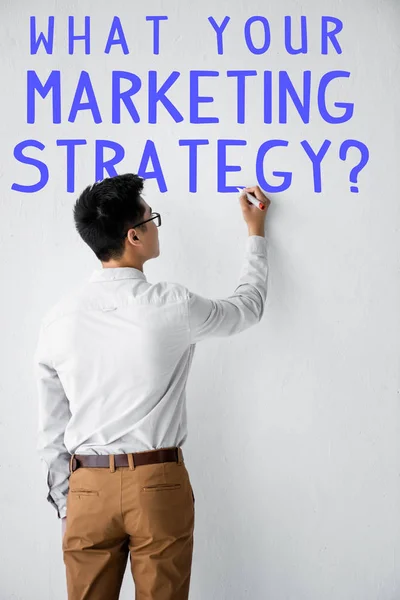 Back View Seo Manager Writing Wall What Your Marketing Strategy — Stock Photo, Image