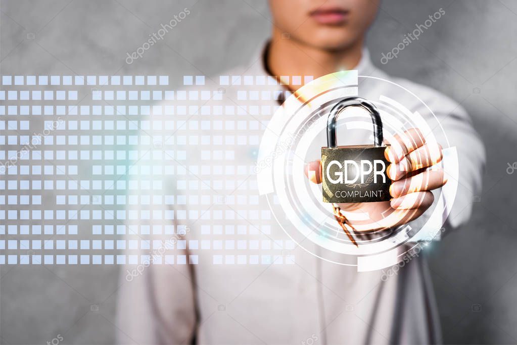 cropped view of businessman holding metal padlock with gdpr lettering and illustration 