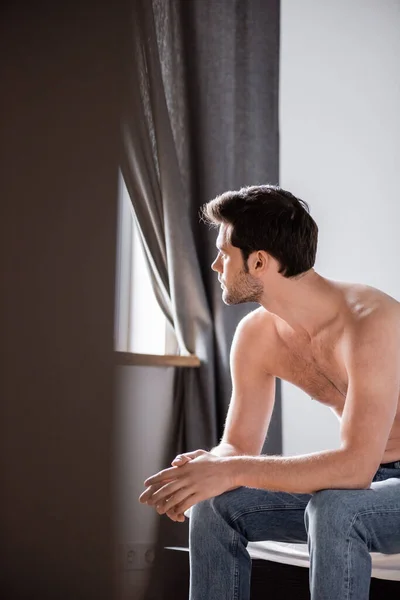Handsome Pensive Shirtless Man Jeans Sitting Bed Selective Focus — Stock Photo, Image