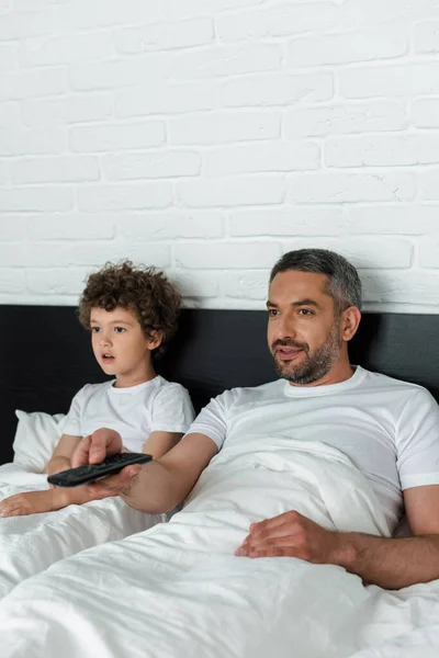 Selective Focus Bearded Father Holding Remote Controller Surprised Son — Stock Photo, Image