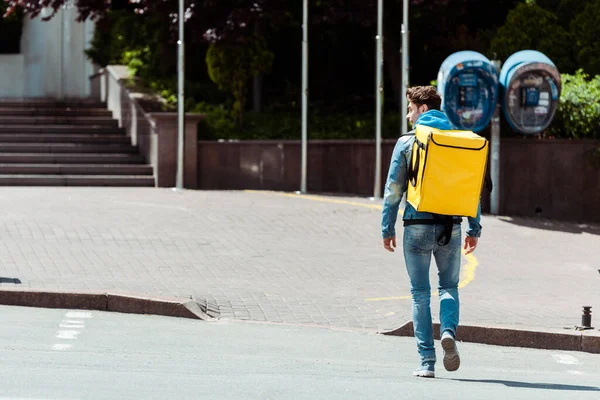 Back View Courier Thermo Backpack Walking Crosswalk Urban Street — Stock Photo, Image