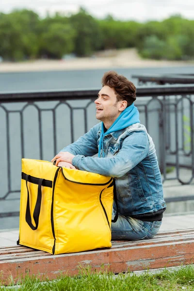 Side View Handsome Delivery Man Looking Away Thermo Bag Bench — Stock Photo, Image