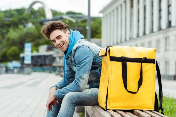 Side View Handsome Courier Smiling While Sitting Thermo Bag Bench — Stock Photo, Image