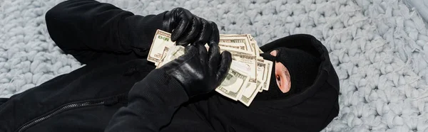 Panoramic Shot Thief Balaclava Holding Money Face Bed — Stock Photo, Image