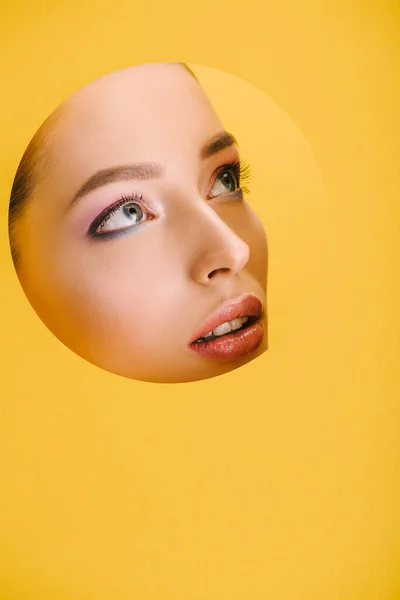 Portrait Beautiful Woman Shiny Makeup Paper Hole Looking Away Isolated — Stock Photo, Image