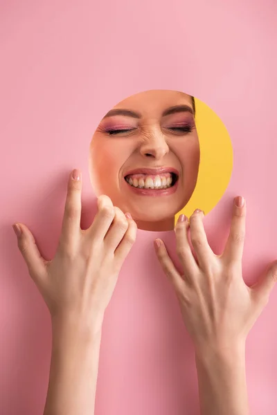 Portrait Beautiful Woman Shiny Makeup Pink Paper Hole Showing Teeth — Stock Photo, Image