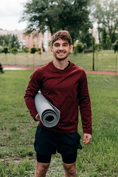 Handsome Sportsman Holding Fitness Mat Smiling Camera Park — Stock Photo, Image