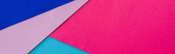 abstract geometric background with pink, blue and violet paper, panoramic shot