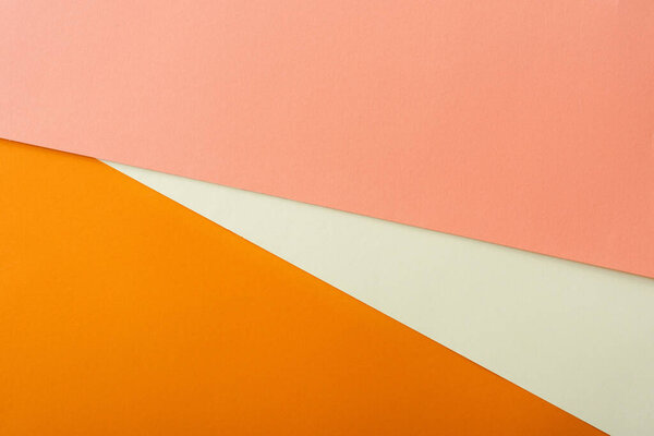 abstract geometric background with white, pink and orange bright paper