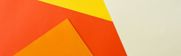 abstract geometric background with white, red, yellow and orange bright paper, panoramic shot