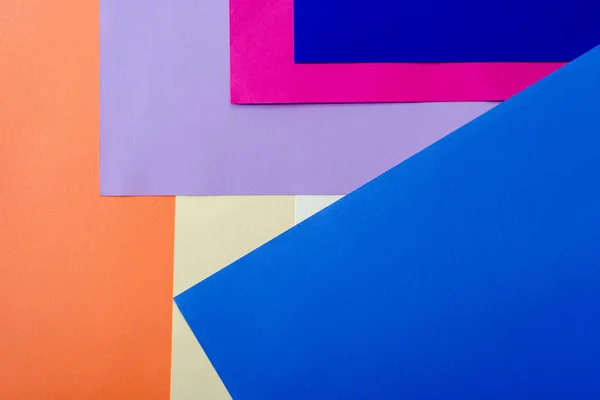 色鮮やかな紙で抽象的な幾何学的背景 — ストック写真