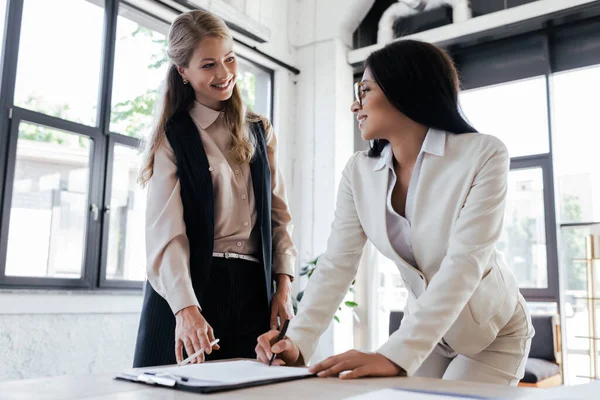 Selective Focus Happy Businesswoman Glasses Signing Contract Looking Coworker — Stock Photo, Image