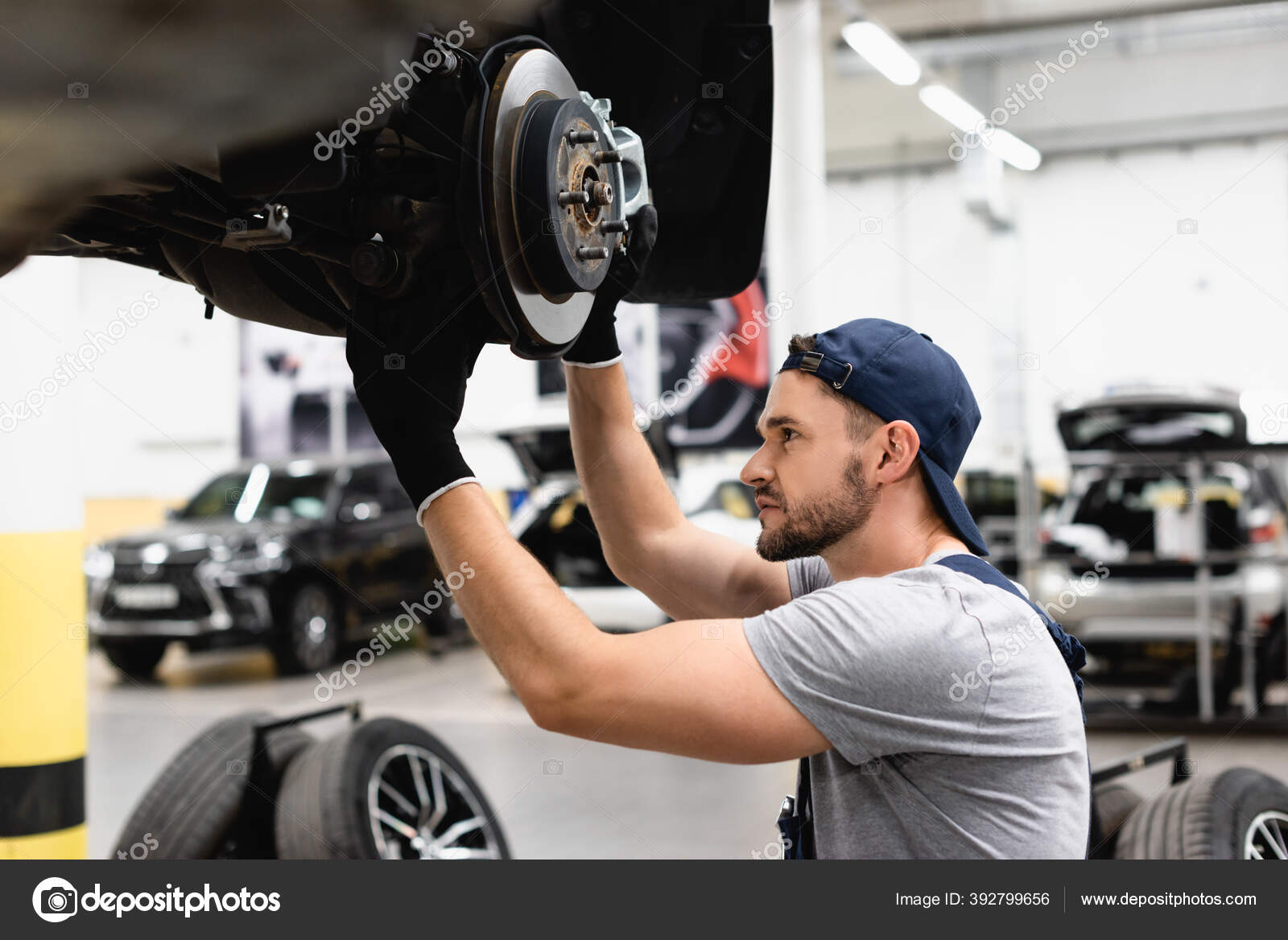 Side View Mechanic Rubber Gloves Touching Car Brake Fixing Vehicle